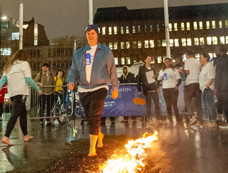Oscar walking across hot coals