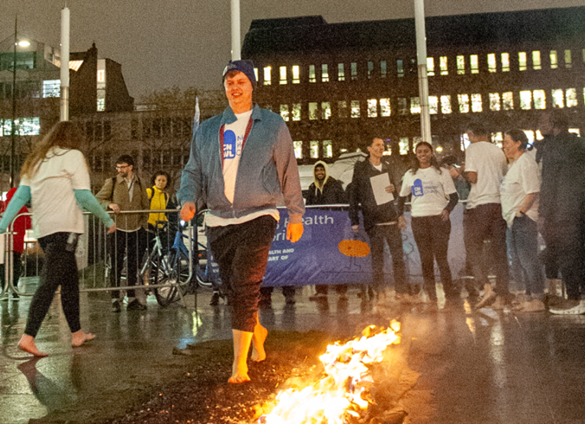 Oscar walking across hot coals