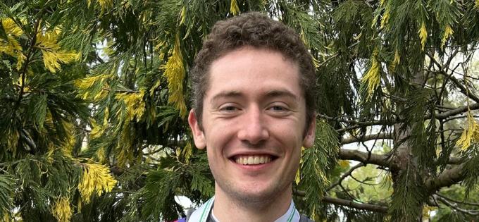 Oli holding his medal