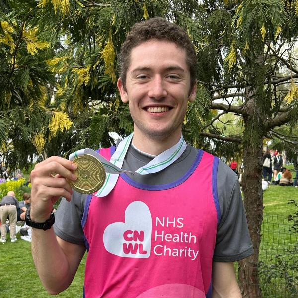 Oli holding his medal