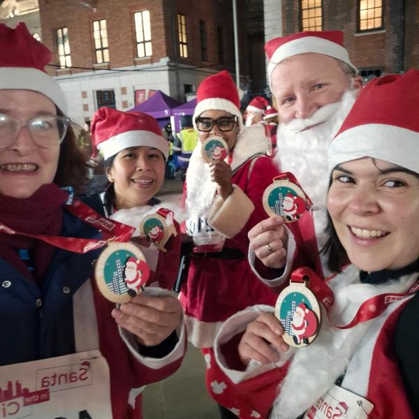 Santa In The City Team Photo With Medals