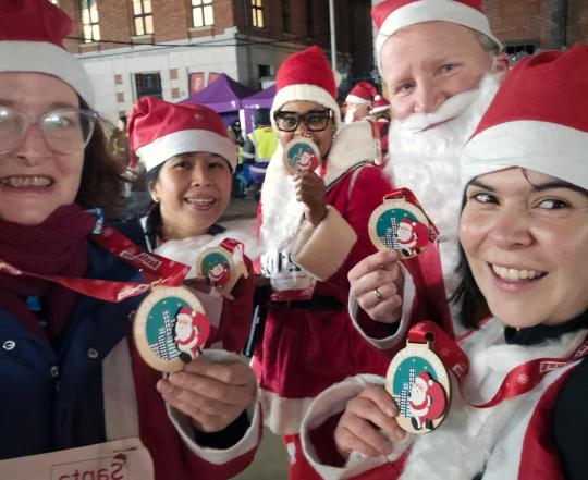Santa In The City Team Photo With Medals