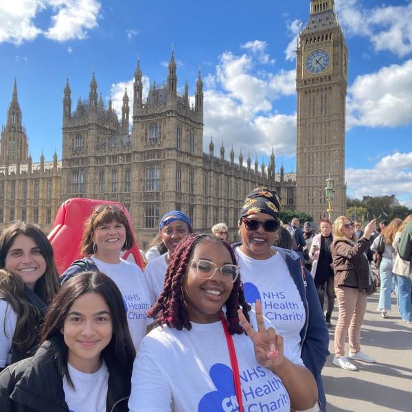 A group of people in front of Big Ben
