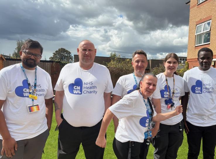 7 members of CNWL TOPAS team standing outside wearing CNWL NHS Health Charity t-shirts