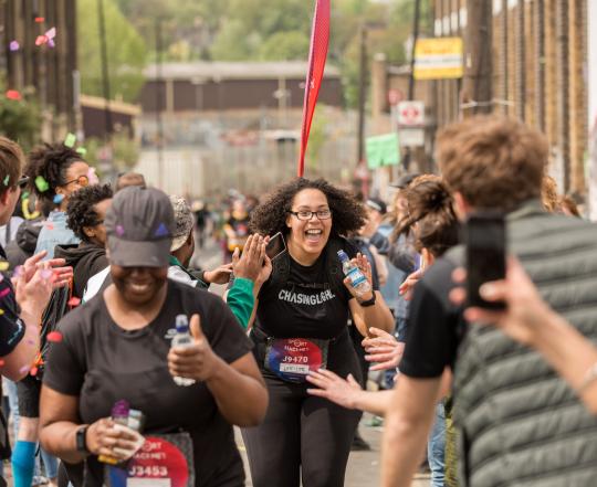 Woman Running The Hackney Half Marathon